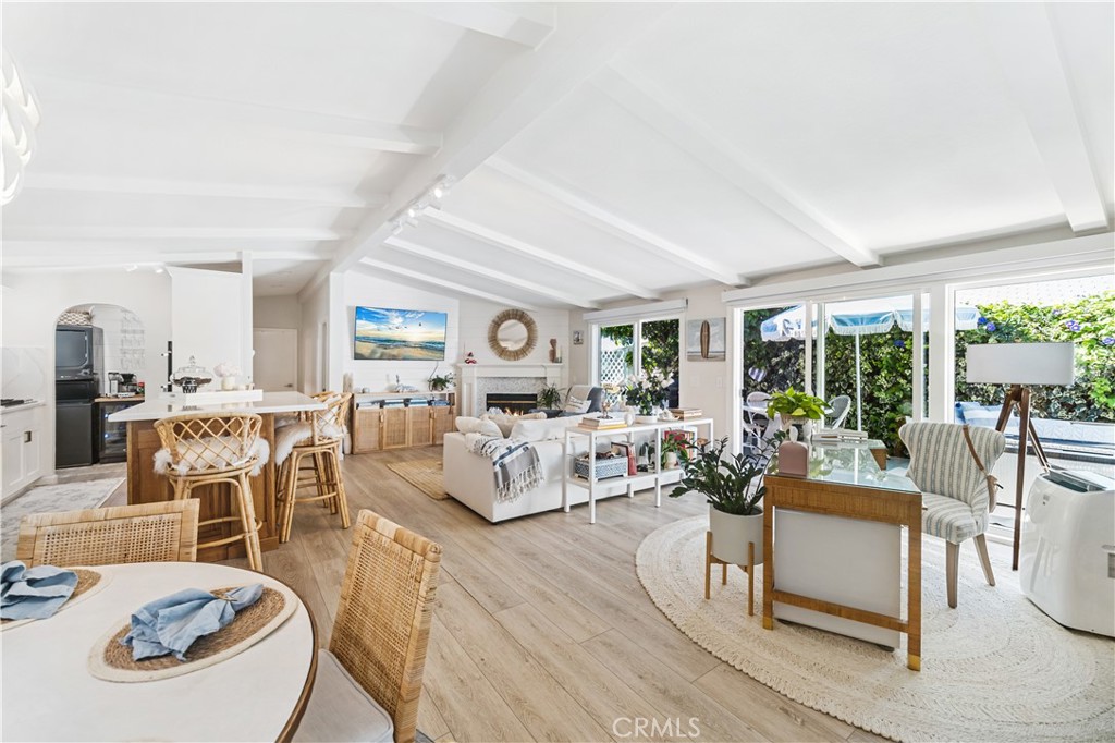 Discover the pinnacle of coastal living in the serene Bayside Village of Newport Beach, California. This meticulously upgraded residence showcases a harmonious blend of luxury and style, offering a truly exquisite living experience. Immerse yourself in the artful design that graces every corner of this home, creating a seamless fusion of timeless sophistication and modern convenience. Upgrades abound, including a convenient coffee station, stackable washer & dryer, and a brand-new roof installed in 2021. You'll appreciate the energy-efficient double-pane windows, a tankless water heater installed in 2022, updated electrical and plumbing, ensuring effortless living. Nestled in a secluded setting adorned with a pergola, an oversized private patio deck, vinyl fencing, and lush landscaping, this home offers an oasis of tranquility. Additional highlights include a newly completed carport with a custom shed, luxury vinyl plank flooring, recessed lighting, 7-inch shiplap walls, 3-blade ceiling fans with LED lighting, wood shutters, and custom closet solutions. The spa-like bathroom boasts a marble shower and a 5-foot deep sunken tub. For added comfort, all windows are tinted, newer toilets and a teak quartz bathroom vanity add a touch of opulence. Cozy up in front of the real wood-burning marble fireplace with a custom mantle, or effortlessly control the shades on the oversized slider doors with a custom remote. The gourmet kitchen is a chef's dream, featuring all-new KitchenAid appliances, an oversized 30-inch sink, custom cabinetry with quartz countertops and backsplash, and a moveable island with a bar-height quartz countertop. Experience the epitome of coastal luxury living in this Newport Beach gem. Property is on leased land with monthly land lease at $3,200 which includes water, trash and numerous community amenities.