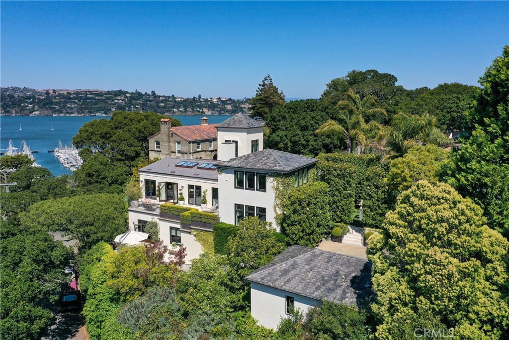 Transformed in 2013 from the iconic Star of the Sea Church into a luxury residence perfectly located overlooking the bay. This home seamlessly merges timeless architecture with modern opulence, creating a sanctuary of elegance and sophistication. Upon entering, you are greeted by a grand foyer leading you to the home’s striking scenery. From this great room you are offered an exceptional vantage point to marvel at the open, panoramic views of the San Francisco Bay. A sweeping staircase descends to the formal dining room, a chef’s kitchen, and an additional living area complete with dramatic fireplace and a myriad of outdoor spaces to enjoy the lush, carefully crafted gardens. Additional features include a luxurious primary suite with two bedrooms, two bathrooms, private entrance, and a media room, a temperature-controlled 300+ bottle showcase wine wall with sliding ladder, an office with 360-degree views - formerly the church tower, a motor court with a gated entrance, a in home gym, and more. Every detail reflects meticulous craftsmanship, with top-quality finishes and materials throughout the spacious home. This estate provides an impeccable setting for hosting grand events and intimate gatherings alike, where sophistication and warmth harmoniously blend. An extraordinary property such as this one offers a rare chance to enjoy an unparalleled lifestyle in one of the world’s most sought-after locales.