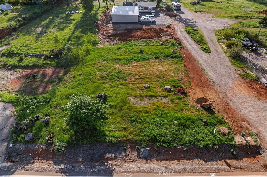 GREAT LOT WITH TRANQUIL VIEWS!! This flat and street-level parcel provides ease of construction, making it an ideal building lot. There is an existing two-bedroom septic system. Septic tank is older and has not been inspected post-fire, but Leach Lines were replaced in 2010. All utilities are available right at the street front and power lines are already underground in this area! Many new homes have already been built in this area and this lot has the added bonus of sitting on the corner of Sawmill & Bailey Lane, giving it great dual access points making it easy to get in and out of this property.  It is only 13 miles to Chico & Hwy 99 providing such an amazingly easy commute with all the benefits of living in a small-town community! This is the PERFECT place to build your next home! With views to the distant valley and the adjacent mountain range and is a short 6-mile drive south to Lime Saddle Marina at the north end of Lake Oroville for those who enjoy the large lake activities of boating, skiing, swimming & fishing. It is also only 10 miles north to the stunning Paradise Lake where you can kayak, canoe & fish while enjoying the serenity of "no motorboats" and maybe spot the bald eagles or other plentiful wildlife! There is also quick access to the West Branch of the Feather River for a summer swim and maybe some gold panning just a few miles up the road...plus so much more! Close to several schools and you are only a few miles away from your local shopping center & post office. With so many outdoor activities out your front door, such convenient access to all the towns shopping, dining & numerous parks as well as the small-town charm, you will fall in love with the community and this heavenly location for your new home!