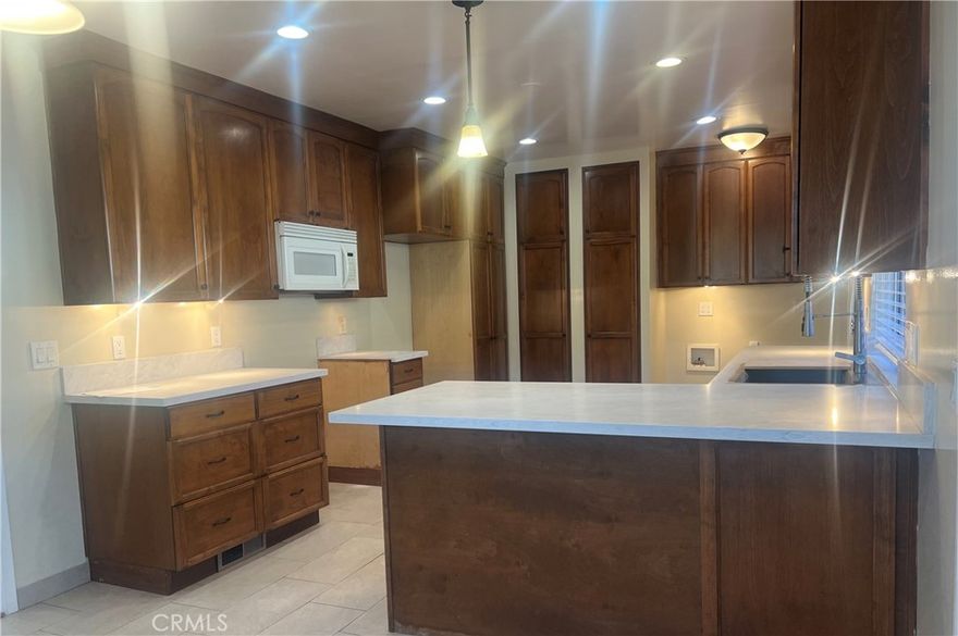 Welcome to this beautiful single-story home located in the highly desirable Northeast Pasadena neighborhood, close to local markets, parks, and mountain views. This spacious 4-bedroom, 2-bath residence features a bright and open layout with brand new flooring and new appliances throughout.

Enjoy a large kitchen with plenty of counter space, perfect for cooking and entertaining. The home offers both a covered and an uncovered patio, deal for relaxing or hosting gatherings. The primary suite includes its own private bath for added comfort.

Additional highlights include a circular driveway with parking for two cars, central A/C and heating, and a peaceful location near the foothills. A wonderful place to call home in a quiet, well-established community.