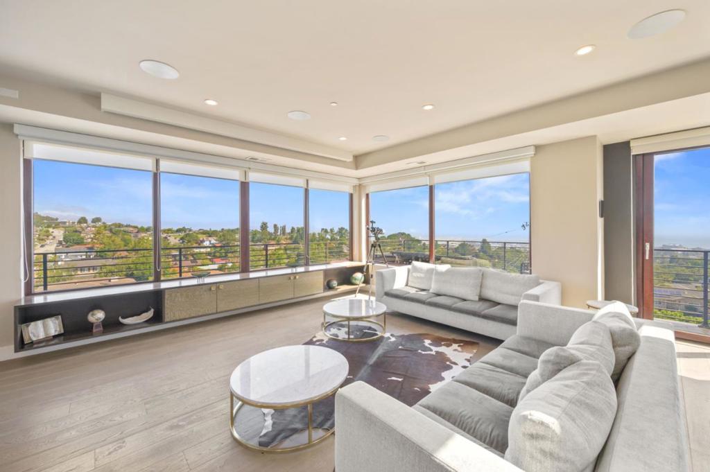 Welcome home to the crown jewel of Burlingame Hills! Impressive custom built home perched on one of the highest points of the neighborhood w/ sweeping views of the city & bay. Fine luxury finishes throughout including a foyer w/ double hardwood doors to welcome you, an open floor plan w/ high ceilings, an elevator, two primary bedroom suites, & an additional living space downstairs w/ wet bar. A dream chef's kitchen w/ wrap around quartz countertops, large island w/ additional prep sink, high-end stainless appliances including a 6-burner gas stove, & walk-in pantry. Beautiful hardwood floors throughout, a see-through fireplace, wood frame windows & sliders, glass railings, luxury wallpaper, a drop down projector screen plus built-in speakers, & custom automatic window shades. Views galore from your multi-level wrap around custom decks overlooking the infinity edge pool w/ hot tub heated by solar panels. Highly sought after location & conveniently located within a desirable school district, Highway 280, Burlingame Plaza Shopping Center, Mills-Peninsula Medical Center, Bart, & San Francisco International Airport. Truly a special home & not one to miss!