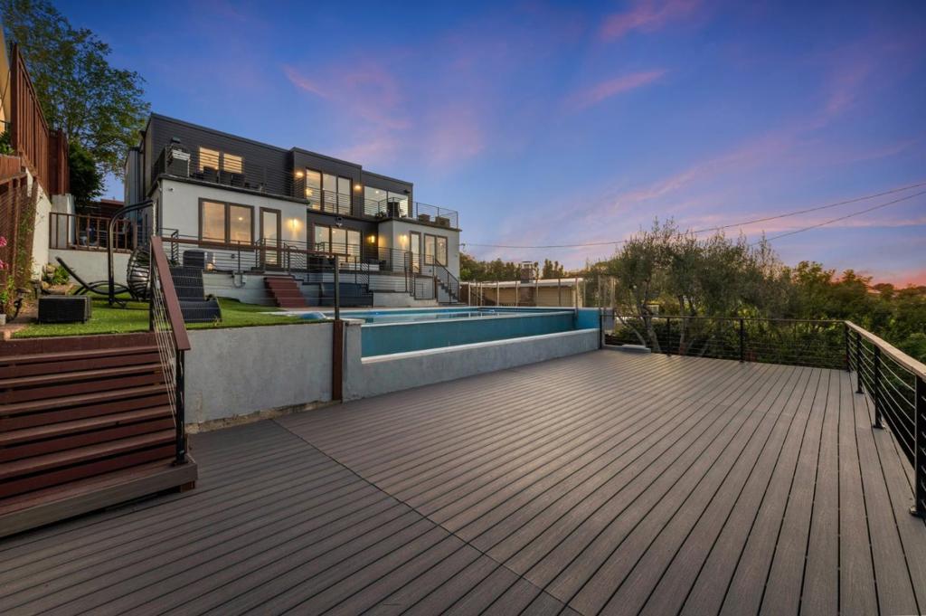 HUGE $1,000,000 PRICE ADJUSTMENT! Welcome home to the crown jewel of Burlingame Hills! Impressive custom built home perched on one of the highest points of the neighborhood w/ sweeping views of the city & bay. Fine luxury finishes throughout including a foyer w/ double hardwood doors to welcome you, an open floor plan w/ high ceilings, an elevator, two primary bedroom suites, & an additional living space downstairs w/ wet bar. A dream chef's kitchen w/ wrap around quartz countertops, large island w/ additional prep sink, high-end stainless appliances including a 6-burner gas stove, & walk-in pantry. Beautiful hardwood floors throughout, a see-through fireplace, wood frame windows & sliders, glass railings, luxury wallpaper, a drop down projector screen plus built-in speakers, & custom automatic window shades. Views galore from your multi-level wrap around custom decks overlooking the infinity edge pool w/ hot tub heated by solar panels. Highly sought after location & conveniently located within a desirable school district, Highway 280, Burlingame Plaza Shopping Center, Mills-Peninsula Medical Center, Bart, & San Francisco International Airport. Truly a special home & not one to miss!