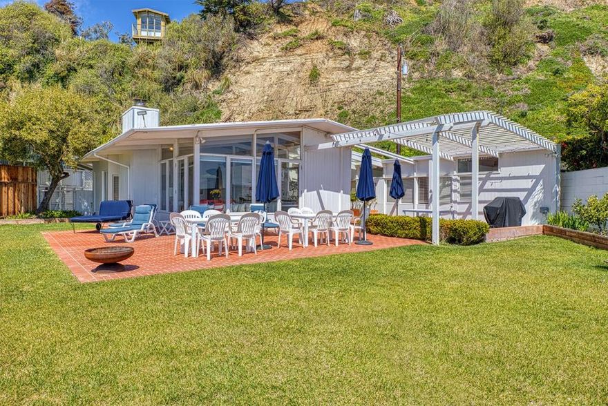 A picturesque oceanfront location. Here on beautiful Monterey Bay, you will find a little piece of paradise. The home is in a gated community with access through Seacliff State Park. Watch the sunrise and be amazed when the moon comes up over the distant mountains. The dolphins and whales are a joy to observe. Roam our wide open beaches. The oversize lot and courtyard give you plenty of room to entertain and to play. The main home has two bedrooms, one bath and an office. Large windows in the living and dining rooms show the expansive views of the Pacific. There are two other bedrooms and two bathrooms on the property. First time on the market. Once you are here, it can be hard to leave. It is time to buy your beach house!