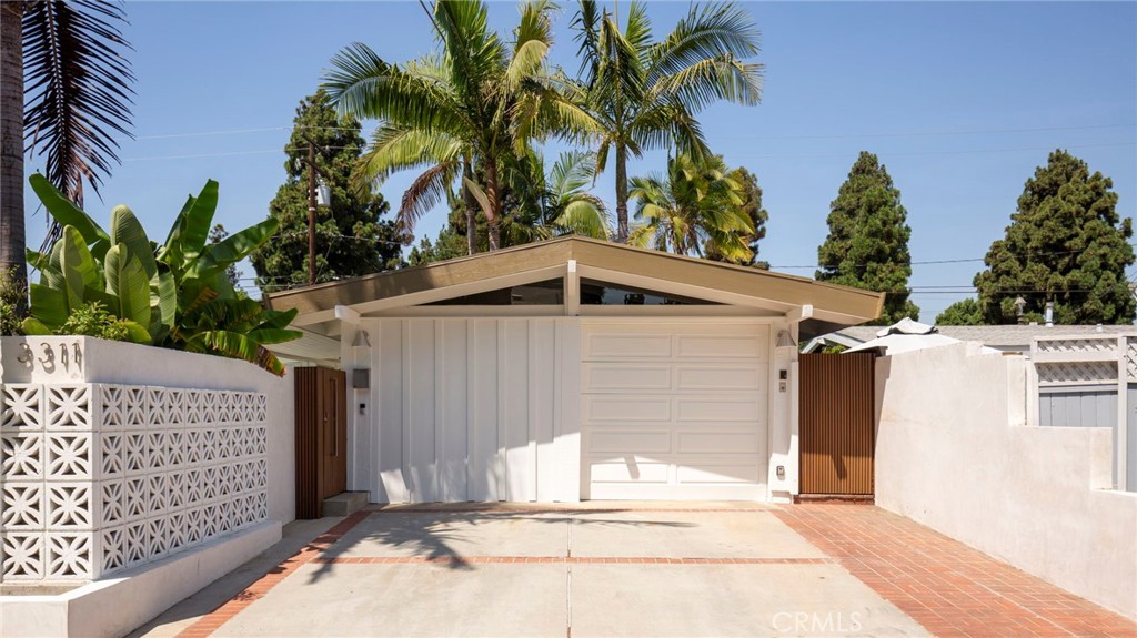Experience the epitome of Southern California modernism in this reimagined Cliff May Rancho, where iconic mid-century architecture meets today’s most coveted upgrades. Behind striking new exterior walls and custom planters, a world of privacy and lush, mature landscaping, including fruit trees, welcomes you home. The seamless indoor-outdoor flow is accentuated by expansive glass doors and freshly refinished cement floors, creating the perfect canvas for your personal style.
Entertain effortlessly in the sun-drenched backyard oasis, where a completely upgraded pool and all-new equipment are framed by contemporary pavers, new turf, and vibrant plantings. Host unforgettable gatherings around the outdoor kitchen and BBQ area or unwind in the thoughtfully designed entertainment space, featuring built-in seating, a fire pit, and a decked hot tub with ingenious hidden storage. A sleek glass gate separates the pool for added peace of mind, while the entire space is wrapped in new hardscape for a polished, cohesive look.
Inside, the culinary enthusiast will be drawn to the fully renovated kitchen, equipped with premium appliances, modern cabinetry, and a reverse osmosis water filter. The master suite is a true retreat with an expanded spa-like bath, showcasing a large picture window, and a custom-built walk-in closet. Both bathrooms have been meticulously refinished with contemporary fixtures and finishes. Throughout the home, fresh interior and exterior paint creates a clean, inviting ambiance.
Half of the garage has been thoughtfully converted into a versatile bonus room, offering the perfect space for a home office, creative studio, pool lounge or a gym while still maintaining practical storage and functionality. This flexible area adapts to your lifestyle needs, bringing even more value and usability to the home.
Every upgrade has been carefully integrated to honor the home’s architectural heritage while offering the utmost in comfort and style. This is California living at its finest! Where timeless design and modern luxury come together in a private, resort-style sanctuary. Don’t miss your chance to own this one-of-a-kind Rancho gem.