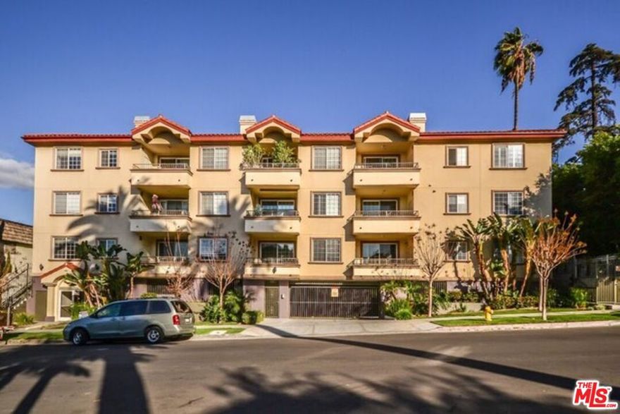 LUXURIOUS TWO-STORY CONDO NEAR KOREATOWN. Built in 2006, this elegant townhome-style condo features 2 spacious bedrooms, hardwood floors, and a modern kitchen with granite countertops, tiled floors, stainless steel appliances, and a dishwasher. The large balcony offers a peaceful tree view, creating a warm and inviting atmosphere throughout.Located in a quiet and well-maintained community, just minutes from Hancock Park, markets, banks, shops, and public transportation. Clean, updated, and move-in ready!