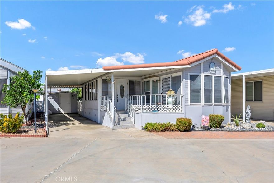 Welcome to Mountain Shadows, a premier 55+ gated resort community where you own your own land—an uncommon and highly sought-after feature in senior communities! This charming home offers not only comfort and value but also a lifestyle designed around convenience, social connection, and relaxation. Located toward the back of the community near Clubhouse 2, this property provides easy access to all of Mountain Shadows’ impressive amenities. Inside, you’ll appreciate the remodeled kitchen with modern finishes and the tile flooring throughout, which creates a clean, low-maintenance living environment. An enclosed patio room adds versatile extra space, ideal for a hobby area, sunroom, or quiet retreat. Outside, the long carport offers ample covered parking and leads to a large storage shed with washer and dryer hookups, providing both practicality and extra functionality. Monthly HOA dues are $243.65, which cover water, sewer, trash, basic cable, and internet—making daily living simple and affordable. Mountain Shadows residents enjoy a true resort-style lifestyle, with two clubhouses, heated saltwater pools and spas, fitness rooms, game and meeting rooms, outdoor kitchens, and a wide array of social events and activities such as dinners, dances, karaoke, and bingo. Beyond the gates, you’ll love the home’s convenient location close to shopping centers, restaurants, medical offices, and other local services—everything you need is just minutes away. Whether you are searching for a full-time residence or a seasonal getaway, this home offers the rare opportunity to combine land ownership, low-maintenance living, and a vibrant community atmosphere in one of Hemet’s most desirable senior neighborhoods.