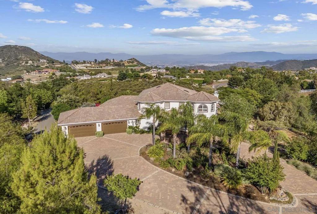 Exceptional 5-bedroom, 5.5-bath custom estate situated on 5.3 private acres in the prestigious La Cresta community. This spacious 5,100+ sq ft home features soaring ceilings, a chef’s gourmet kitchen, and a luxurious primary suite with breathtaking panoramic views. Enjoy serene patios and mature landscaping perfect for entertaining or relaxing. The fully equipped equestrian barn with stables offers an ideal space for horse enthusiasts or versatile uses. A rare opportunity to own a private, elegant retreat just minutes from Murrieta’s vibrant amenities.