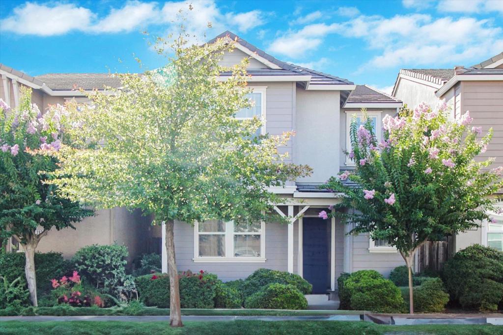 Welcome to your dream home in North Natomas! This beautifully maintained former model home is packed with premium upgrades and thoughtful design features throughout. Step inside to discover high-end cabinetry, granite slab countertops, Walk-in Pantry, crown molding, built-in speakers on the main level, and stylish tile flooring. The open-concept kitchen is a chefs dream, complete with a gas range, stainless steel appliances including refrigerator and microwave, an oversized island with sink, and plenty of counter and cabinet space for all your culinary needs. This charming residence features three generously sized bedrooms, including a spacious primary suite with a large walk-in closet and a dual-sink vanity bathroom for ultimate comfort and privacy. The second floor also offers a versatile loft area, perfect for an office or media space, along with a conveniently located laundry room. Enjoy year-round comfort with a newer 2-zone A/C system and ceiling fans in every room. Home also has new hot water heating. The attached two-car garage provides ample parking and storage, while the inviting front porch offers a welcoming space to unwind or greet neighbors. Located within the highly regarded Natomas Unified School District, this home combines quality, comfort, and convenience.