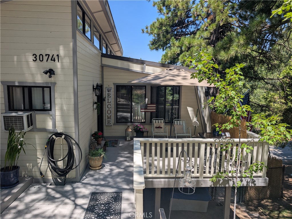 Welcome to your new mountain home. This house is nestled among tall pine trees, this spacious mountain house is ideally situated between Running Spring and Big Bear. With excellent access to Highway 330, residents enjoy being just 25 minutes from Redlands and San Bernardino. This house is designed for families who love outdoor activities. The home is perfect for skiing in the winter and hiking or water sports in the summer. The home has four bedrooms and a office or craft room. The master bedroom features a large walk in closet, an ensuite bathroom complete with a tub and shower. And lots of storage. Two additional downstairs bedrooms share a Jack and Jill bathroom, mirrored closets and windows looking out on beautiful trees. The main floor offers a welcoming living room with a large fireplace, a kitchen with ample storage and a garden window. A dining room that flows seamlessly between the kitchen and living room. This space is ideal for quite nights at home or family events. The main floor also features a bedroom and bathroom. The house is beautifully landscaped with grass and flowers. A large deck expends from the living area, providing a wonderful space for family events while enjoying the views of the valley and mountains. The house also has two refrigerators, two furnaces. Some furniture will stay a twin bed and patio furniture. Don't miss this beautiful and well maintained house.