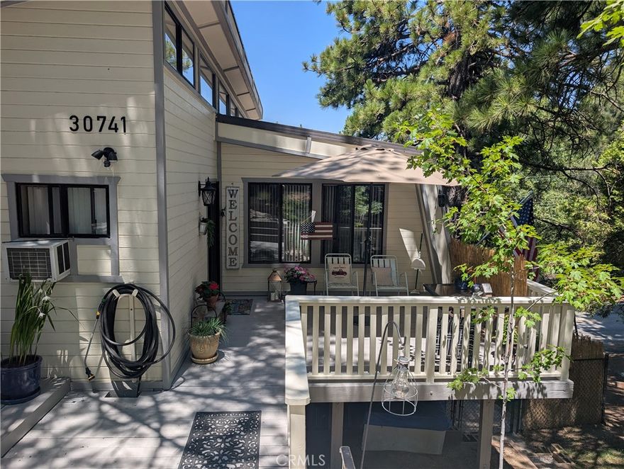 Welcome to your new mountain home.  This house is nestled among tall pine trees, this spacious mountain house is ideally situated between Running Spring and Big Bear. With excellent access to Highway 330, residents enjoy being just 25 minutes from Redlands and San Bernardino.  This house is designed for families who love outdoor activities.  The home is perfect for skiing in the winter and hiking or water sports in the summer. The home has four bedrooms and a office or craft room.  The master bedroom features a large walk in closet, an ensuite bathroom complete with a tub and shower. And lots of storage. Two additional downstairs bedrooms share a Jack and Jill bathroom, mirrored closets and windows looking out on beautiful trees. The main floor offers a welcoming living room with a large fireplace, a kitchen with ample storage and a garden window.  A dining room that flows seamlessly between the kitchen and living room. This space is ideal for quite nights at home or family events.  The main floor also features a bedroom and bathroom. The house is beautifully landscaped with grass and flowers.  A large deck expends from the living area, providing a wonderful space for family events while enjoying the views of the valley and mountains.  The house also has two refrigerators, two furnaces.  Some furniture will stay a twin bed and patio furniture. Don't miss this beautiful and well maintained house.