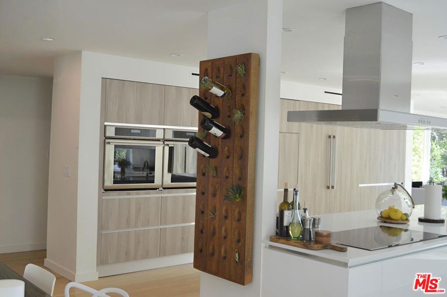 Luxury and fully remodeled 5BR/4BA two-story single-family home in the highly coveted Westwood Charter School District. Ideally located in the heart of the Westside, this home offers exceptional access to UCLA, Westfield Century City Mall, Beverly Hills, the Metro, Rancho Park Golf Course, and Cheviot Hills Parks. This spacious residence features 5 bedrooms and 4 bathrooms, with 3 bedrooms and 2 bathrooms upstairs, plus a private office/bedroom, a guest room, and 2 additional bathrooms downstairs, perfect for families, guests, or a home workspace. Enjoy cooking and entertaining in the custom Italian gourmet chef's kitchen, complete with premium finishes, an oversized island, dual built-in ovens, two dishwashers, two sinks, and an extra-large 60-inch refrigerator/freezer. The open-concept living room, dining area, and family room flow seamlessly together, creating a bright and inviting atmosphere. Modern upgrades include hardwood floors, recessed lighting, central HVAC, and abundant natural light throughout. Additional highlights: Universal EV (electric vehicle) wall charger, fully remodeled interior with designer finishes, Private backyard, Washer and dryer included, ample parking, quiet, tree-lined street. Located moments from top-rated schools, shopping, dining, and parks, this property combines modern luxury, unbeatable location, and flexible living space, a rare find in West LA.