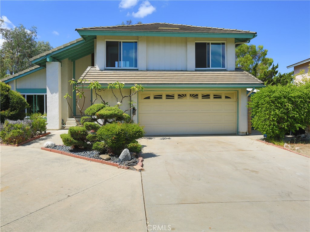 Welcome to this beautifully remodeled home in the prestigious Walnut Valley School District. Recently updated with fresh interior paint, brand new flooring, and fully renovated bathrooms and kitchen, this residence features a new stovetop, range hood, and dishwasher for modern living. The elegant circular driveway in the front provides ample parking for residents and guests alike. Conveniently located within walking distance to Maple Hill Elementary School, Chaparral Middle School, and a community park with lighted tennis courts, the home offers both comfort and lifestyle. The backyard is a private oasis with a sparkling swimming pool, surrounded by lush landscaping, colorful flowers, and mature trees—perfect for entertaining or relaxing in a serene setting.