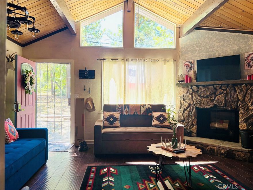 Good things come in small packages, just like this amazing light and bright chalet ready to generate you income when you're not using it. It has an updated kitchen with stone countertops & beautiful cabinetry, an open floor plan, updated bath, magical private back yard and soothing spa. It was recently replumbed and has a new tankless water heater, newer roof, dual pane windows, and the exterior paint is fresh. The outside feels even more spacious because it's located next to a large empty corner lot. It's being sold fully furnished with brand new furniture and a newly issued short term rental permit.