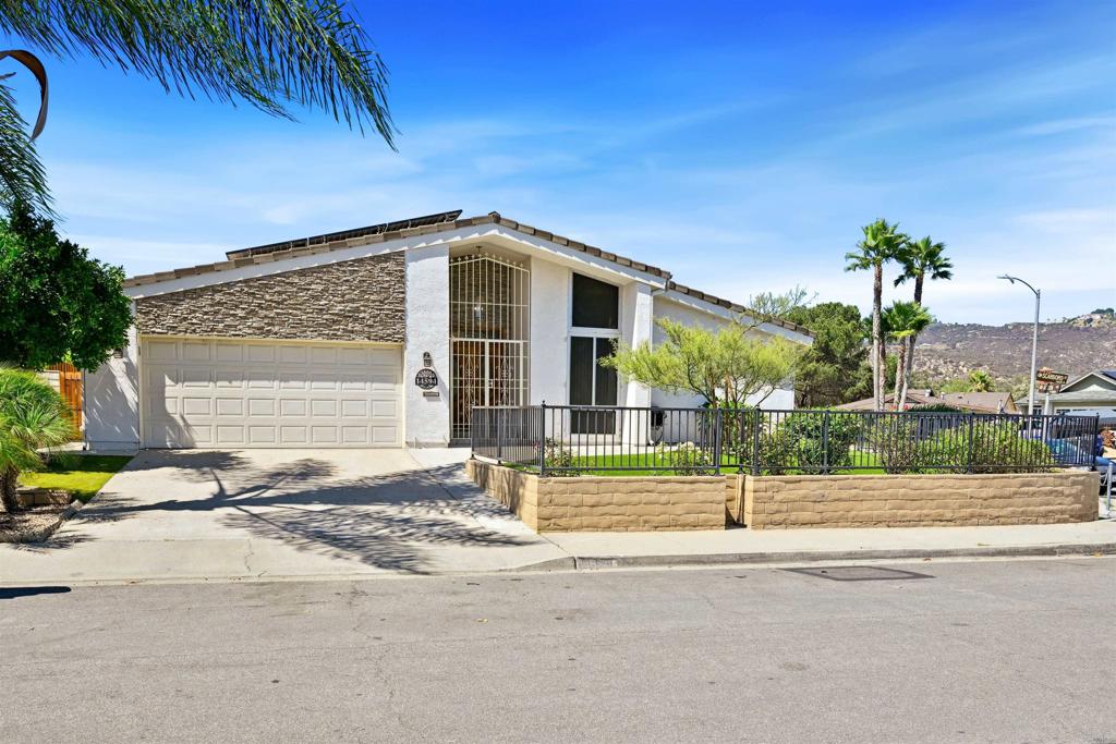 This beautifully maintained single-story home sits on an expansive corner lot within a peaceful neighborhood. With soaring high ceilings, the open floor plan offers a bright and inviting living space. The kitchen features a large center island and plenty of storage. The exterior boasts turf, storage shed, solar system, and an impressive 100-foot custom concrete RV landing with a clean-out station—ideal for RV or boat parking. The great backyard is enhanced by a custom block wall and decorative wrought iron fencing, this property offers both style and functionality. Excellent Poway Schools are an added bonus too! Don’t miss this rare opportunity to own a spacious and well-appointed single-level home with unique features inside and out!