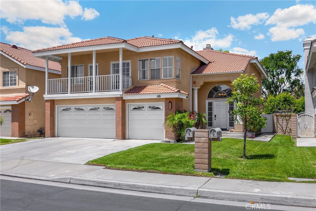 Nestled in the prestigious Cypress Park gated community, this meticulously maintained 2-story residence offers 4 bedrooms and 3 bathrooms. Built in 1994, the home boasts timeless appeal with modern upgrades throughout. Situated on a cul-de-sac, the home boasts a stylish living and dining area with vaulted ceilings, crown molding, and wood flooring throughout. The kitchen has been updated with soft-close cabinetry, quartz countertops, and stainless-steel appliances. It seamlessly opens to a family room featuring an exposed brick fireplace. The main floor includes a bedroom and a full bathroom, while the upper level features a bonus room that could serve as a fifth bedroom, complete with a front balcony. The master suite offers a retreat area with a dual-sided fireplace, enhancing the living space. The private backyard is home to persimmon and tangerine trees, providing a serene environment. The home includes a three-car garage with ample storage space. Enjoy all the benefits of living in the gated Cypress Park community, including a sparkling pool, spa, tennis courts, playgrounds, picnic areas, and scenic walking trails—all with a low HOA. Located just minutes from shopping, dining, and major freeways, this move-in-ready home is a must-see for anyone seeking upscale living in a secure, family-friendly neighborhood.