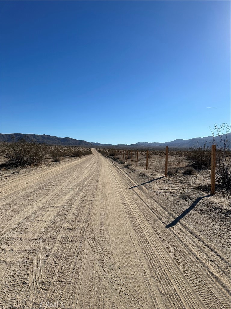 This parcel is an excellent oasis for a project on the edge of 29 Palms. Two 5 acre parcels already split and ready for your next project. The parcel is 5 minutes from the National Park Entrance and 1 minute from the city services yet feels very secluded. So far the 10 acres have been fenced for privacy and there is a Vintage RV being offered with the property in good condition to use for storage or construction trailer for a project.