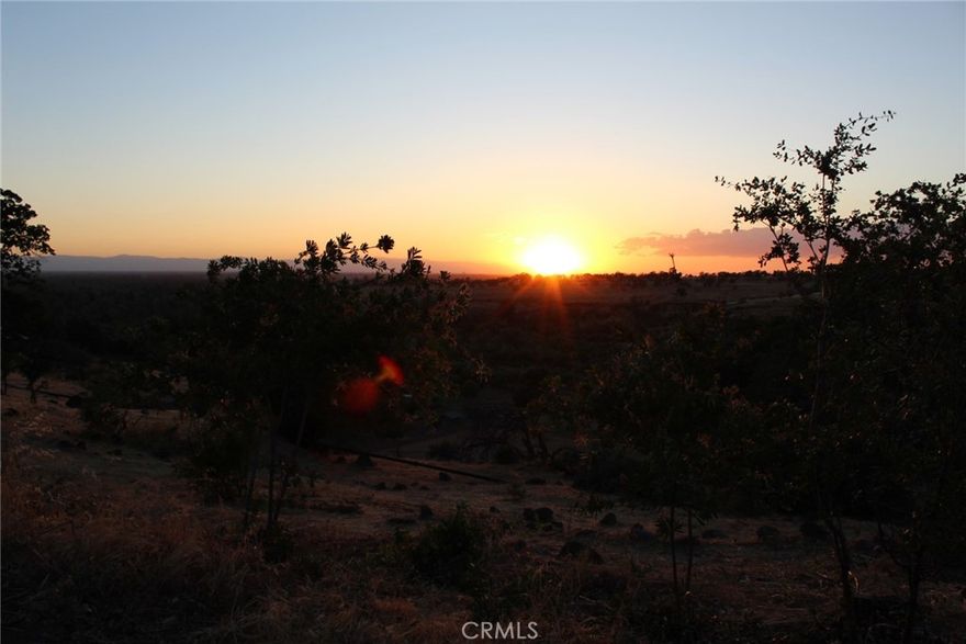 AWESOME CANYON RIM VIEWS! Close to city and yet feels so far away, in open, peaceful Skansen development.Spectacular sunsets, soaring bald eagles, deer and turkeys browsing your property. Fencing on west side belongs to neighbors.  After-dark views of Chico city lights and beautiful moon rises.Panoramic views of Butte Creek canyon and Coastal Range. Spacious park-like setting with plenty of room to plan your ideal home on this 1.36 acre parcel. Water and sewer connections available on site.  Less than ten minutes to major shopping,services, and dining areas in Chico.  Take a look soon!