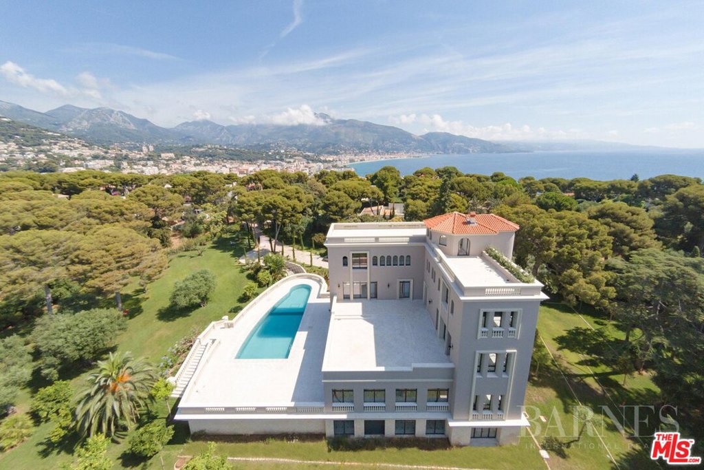 Located Between Menton and Monaco, Roquebrune-Cap Martin was long one of the most sought-after locations by both artists and the aristocracy of the Belle Epoque. The medieval village huddled around the villa rears up above Cap Martin, a well-preserved heaven with Mediterranean greenery. This historical property from 1930 has been fully renovated, and is surrounded by 3.5 acres on a huge flat yard. This 4-story property features spacious living, family, and dining rooms, an elevator, and all of this on 14,000 sq ft. Its gorgeous garden facing the sun, offers a pool on the vast balcony of 3,000 sq ft. with specular views. One level is entirely dedicated to the bedrooms, offices opening on the balcony. Total 6 master bedrooms, a movie- theatre, a fitness room, and on the roof, another balcony with spa and a 360 panoramic view on the Cap, the sea, Monaco and Italy. Added to this, a maid-suite, and a 12 car-garage.