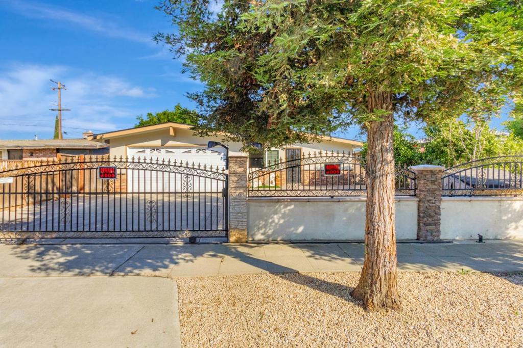 Beautifully Remodeled Home in the Heart of Silicon Valley Welcome to this charming and private ranch-style home nestled in the Alum Rock neighborhood of San Jose. Thoughtfully updated throughout, this residence features 3 bedrooms, 2 bathrooms, and a versatile bonus room (garage conversion) offering flexibility for a home office, guest room, or creative space. Enjoy 1,040 sq ft of comfortable living on a spacious 5,150 sq ft lot. Step inside to an open and inviting floor plan with brand-new wood flooring and airy vaulted ceilings. The remodeled kitchen boasts granite countertops, new tile flooring, stainless steel appliances, and warm wood cabinetry perfect for everyday living and entertaining. Additional upgrades include: Skylights and recessed lighting that fill the home with natural light. Central Heating & Cooling. Remodeled bathrooms with modern vanities and elegant tile. Fresh interior paint and a new roof. The elegant landscaped backyard is ideal for outdoor entertaining, featuring pavers, a covered patio, mature fruit trees, includes a custom build storage, and gazeboperfect for family gatherings or weekend barbecues. A MUST SEE!!!