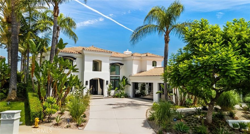 Welcome home to this stylish and elegant home in the guard-gated community of The Ridge in the heart of Calabasas. Situated near the end of a cul-de-sac, this extensively renovated home has been updated to the highest standards - with no expense spared - and is perfectly designed to enjoy indoor-outdoor living at its best. As you enter the two-story foyer, you'll notice the gorgeous large slab limestone floors, an abundance of natural light, and beautifully appointed formal living and dining rooms on either side.  Just beyond, the spacious family room with fireplace looks out over the entertainer's backyard and flows into the show-stopping chef’s kitchen, featuring striking Calcutta Borghini marble counters and center island, Wolf appliances, custom solid flat sawn white oak cabinetry, and Zellige tiles.  The lower level also includes an office overlooking the backyard, a bedroom with en-suite bath, and a fabulous powder room with a backlit onyx sink. The beautiful limestone extends upstairs, with 10" wide European white oak wood flooring covering the remainder of the residence. Once upstairs, you find a generous loft/family room and a balcony with sweeping views. The private primary suite boasts stunning views, a two-sided fireplace, and a luxurious spa-like bath with a soaking tub, large walk-in shower, and dual custom closets - all crafted with timeless, high-end materials. The refined details extend to the secondary bathrooms, where you'll also find solid white oak cabinets, hand-made and cut terra cotta and marble flooring, Zellige tiles, and premium fixtures. The backyard oasis features a pool and spa framed by beautiful hedges and includes a fire-pit, a bbq area with a pizza oven, a cozy dining area, and lush, sophisticated landscaping - perfect for both relaxing and entertaining. Finally, this home is outfitted with a tankless water heater, premium audio, and a comprehensive video security system.