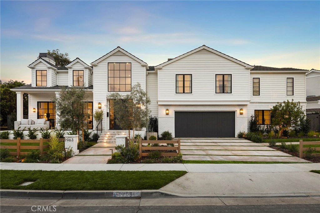 Discover unparalleled elegance in this completely re-designed 2024 custom-built estate, perfectly positioned on a coveted 9,000 sqft corner lot in the prestigious Port Streets. Spanning 5,306 sqft of impeccably designed living space, this home blends exquisite craftsmanship with thoughtfully curated finishes. White wide plank French oak flooring leads you through an inviting, light-filled interior. The elegant living room, warmed by a charming stone fireplace, features French doors that open to a welcoming front porch. At the heart of the home, the chef’s kitchen with dual islands is a masterpiece of both design and functionality. Equipped with a Wolf six-burner range, Sub-Zero refrigerator, dual Bosch dishwashers, a wine refrigerator, and Wolf cappuccino maker, this space is built for both casual dining and entertaining. Two expansive islands adorned with Taj Mahal quartzite countertops offer generous prep space, complemented by striking pendant lighting that adds to the home's refined ambiance. Seamlessly integrating indoor and outdoor living, the adjacent family room opens through bifold doors to a beautifully landscaped backyard including a lush lawn creating a private retreat, perfect for both relaxation and entertaining. A dedicated home office, enclosed with French doors, offers a quiet space for productivity. The main-level guest suite provides a private sanctuary with serene front-yard views and an en-suite bath featuring a walk-in shower—ideal for visitors or extended family. Upstairs, the primary suite is a true haven, featuring a spa-inspired bathroom with a soaking tub, dual-head showers, dual vanities with striking Calcutta black marble countertops, and custom white oak cabinetry. His-and-her walk-in closets with built-ins offer exceptional storage, while a private balcony provides a tranquil escape. The second level also includes three additional bedrooms, two stylish bathrooms, and a thoughtfully designed laundry room with a utility sink for added convenience. Additional highlights include recessed lighting, prewiring for a premium entertainment system, a spacious two-car attached garage, and a well-appointed wine cellar. Ideally located within the award-winning Andersen Elementary Blue Ribbon school district and just moments from the upscale shopping and dining of Fashion Island, this exceptional residence offers the perfect blend of style, comfort, and modern convenience in one of Newport Beach’s most sought-after neighborhoods.