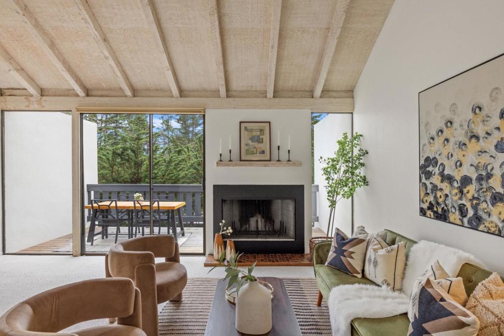 Tucked away above the Carmel coastline is this inviting 2-bedroom, 1.5 bath gem offering the perfect blend of coastal charm and everyday comfort. With 1,197 square feet of light-filled living space, this thoughtfully designed getaway is ideal as a weekend retreat or full-time residence. Step inside the private courtyard to find a warm entryway accented by rich wood floors that leads you to an open living room area with open beam ceilings, wood-burning fireplace, and large windows that welcome in the natural light. The kitchen is both functional and inviting and opens onto the courtyard for al fresco dining. Enjoy your coffee or sunset wine from your private deck, or take a stroll in the friendly neighborhood. Outside your door, the community offers a sparkling pool and two tennis courts ideal for weekend relaxation or staying active. This residence also enjoys a prime location just minutes from the charm of downtown Carmel, the natural beauty of Carmel Beach, and the world-class dining and cultural offerings of nearby Monterey.This property presents a rare opportunity to own a piece of the Carmel lifestyle!