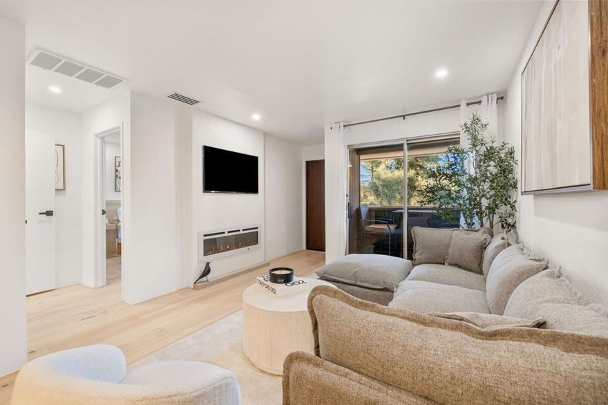 PRICE IMPROVEMENT -- Now $239,000 Fully FurnishedModern Palm Springs Designer Condo | Incredible Value | Custom Furnishings IncludedDiscover one of the best finds in Palm Springs--a fully remodeled, fully furnished condo reimagined with meticulous detail and Japanese-inspired Wabi-Sabi design. Redesigned by a local designer, this home feels warm, refined, and truly one of a kind.Natural light fills the open-concept space, leading to a private patio with 180-degree mountain views and a peaceful overlook of the resort-style pool and spa just steps away. Inside, the living area features a custom fireplace wall with a built-in smart TV, paired with designer-crafted furniture created to match the natural wood floors for a seamless, organic aesthetic. These custom pieces are included, giving the home a move-in-ready, magazine-worthy feel.The modern kitchen showcases sleek cabinetry, under-cabinet lighting, and the rare convenience of an all-in-one washer/dryer thoughtfully integrated into the kitchen--a highly sought-after feature that adds everyday ease without sacrificing style. The spa-inspired bathroom adds a boutique hotel touch with a smart toilet, premium fixtures, and calming contemporary design.Set within a very well-kept community with park-like grounds and plenty of extra parking, residents enjoy 5 sparkling pools, multiple spas, 4 tennis courts, beautifully maintained landscaping, and included water & trash. And because this home sits on fee land, you own the land--an invaluable advantage in Palm Springs.Just minutes from Downtown Palm Springs, golf, hiking trails, and the Aerial Tramway, this fully furnished condo is ideal as a full-time residence, weekend escape, or a thoughtfully curated second home. At this new price point, it's an exceptional opportunity to own a piece of Palm Springs paradise at outstanding value.Welcome to 2857 N Los Felices #203--your modern, move-in-ready Palm Springs retreat.