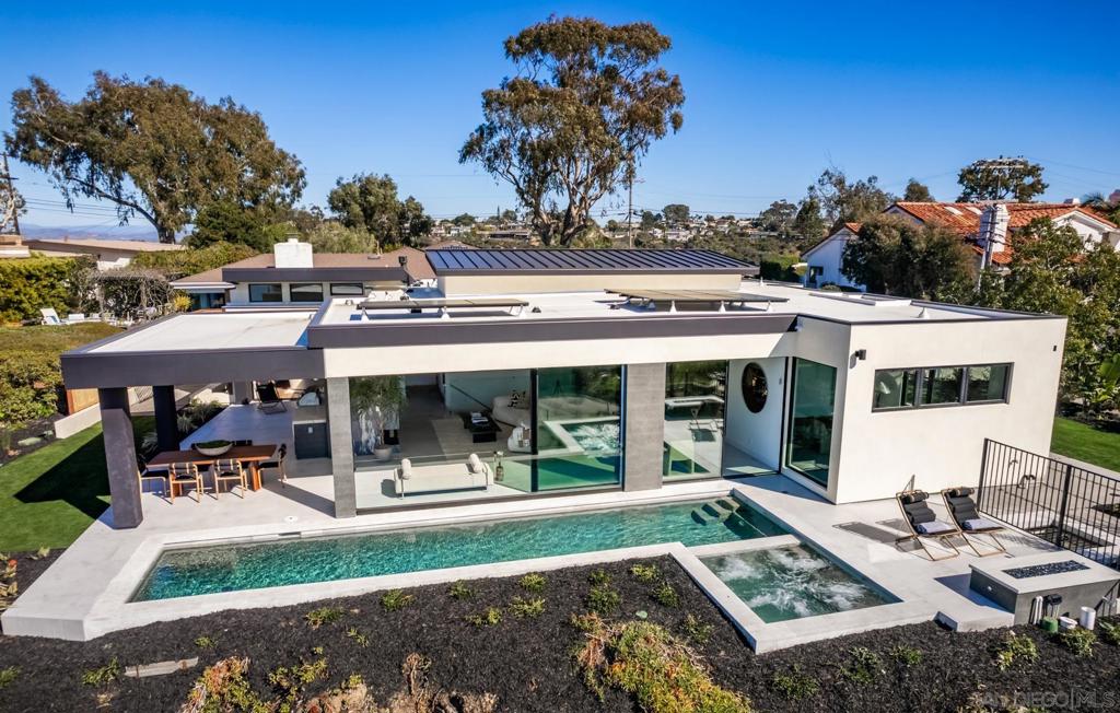 Envisioned by one of Del Mar's most celebrated architectural visionaries and designed in collaboration with a leading California luxury home builder, this incredible contemporary home in Olde Del Mar features 4 bedrooms, 4 full baths, and 2 half baths, seamlessly blending modern elegance with the natural beauty of the Pacific coast. The home’s westerly orientation captures sweeping ocean vistas extending to La Jolla, while maintaining a level of privacy rarely found in this coveted area. Stepping through the 8-foot-wide entry pivot door, you’ll be greeted by soaring 10-15 foot ceilings, clerestory windows, and disappearing nano doors that dissolve the boundaries between indoor and outdoor spaces. Flooded with natural light, this residence is the ultimate embodiment of the elevated Del Mar beach lifestyle. Crafted with the finest materials, the thoughtful design incorporates artistic angles balanced by organic wood and stone elements, creating a serene coastal sanctuary. The expansive living spaces flow seamlessly to the outdoors, where a pool with spa, firepit, and multiple lounges await for enjoying sunsets over the ocean. Exceptional features include a state-of-the-art wellness retreat, complete with a gym, sauna, cold plunge, shower, and provisions for a juice bar. The home also boasts an executive office, a game room lounge with space for a home theater, an entertainer's bar, and temperature-controlled wine storage. Just a short walk to the vibrant shops and restaurants of Del Mar Village, this home is a once-in-a-lifetime opportunity to own a property where timeless elegance meets contemporary coastal innovation. Live the highest standard of beachside luxury in this visionary estate.