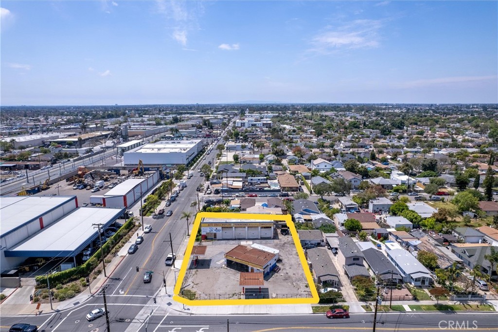 Prime Opportunity for future development potential to invest in the City of Santa Ana that has been progressively advancing community improvements in planned transit and infrastructure. The prime corner 16,199 Sq Ft lot allows for multiple entrance and exit locations for convenient access. The 2 existing structures were used as an auto service facility with a total building size of ~3,330 Sq Ft. The first structure has high roll up doors with 3 bays and an upstairs and downstairs office. The second structure has a 2-vehicle side by side service area and office/store section. Property use code: Commercial, rezoned for residential per the general plan. Per the City zoning and building approval the property has a range of options from residential, churches, schools, child care facilities, or request for re-zone of general commercial or possible mixed-use opportunity.