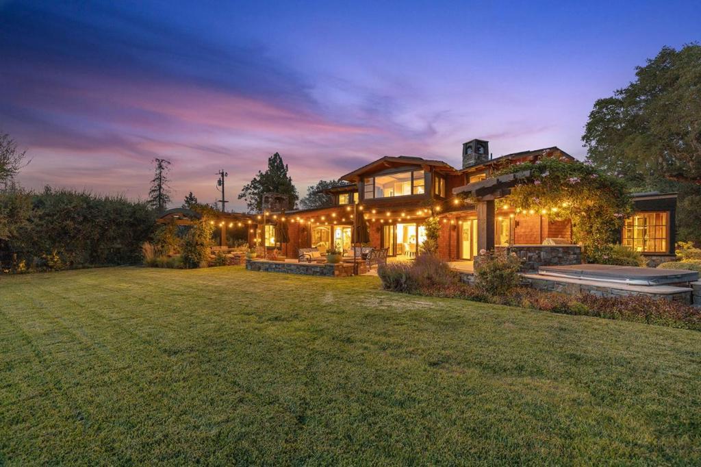Just 4 blocks to town and school, this stunning home is surrounded by natures beauty and western hill views at the end of a long, private lane. Custom built 10 years ago, the home showcases extraordinary details at every turn. The awe-inspiring setting is highlighted by western hill views with outdoor kitchen, spa, fire pit, plus vast level lawn and terrace. The main residence is positioned on 4 acres with 4 bedrooms, 5 baths, 2 offices, gym, fully finished lower level, 3 car garage with rooftop veggie garden. Recreational amenities are plentiful with a life-size chessboard, putting green and basketball court, the lower level is devoted to games, media, wine, & fitness. Access to acclaimed Woodside School makes this the ultimate place to call home. There are two 1 acre adjacent lots which could be sold as well to create a 5 or 6 acre property at the end of a quaint lane off of Canada Road. Create your own compound!