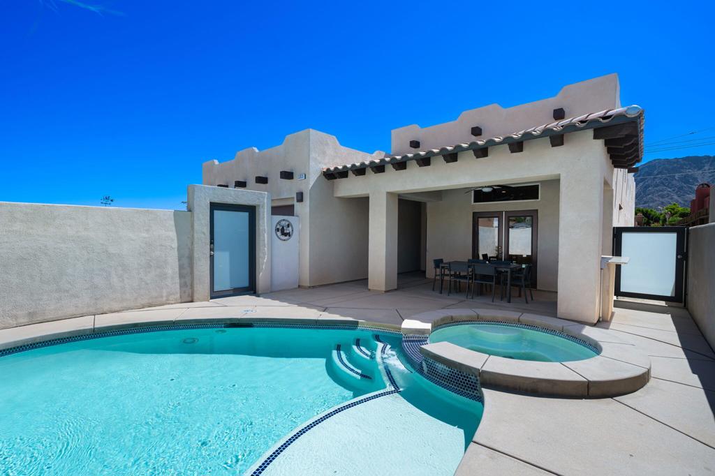 Stunning Sante Fe home located in the heart of La Quinta Cove. Built in 2014, this move-in-ready showpiece offers breathtaking views of the Santa Rosa Mountains and a meticulously maintained interior that blends high-quality Traditional and Contemporary finishes. Step inside to discover a functional and thoughtfully designed floor plan featuring sleek custom flooring and baseboards, high ceilings, recessed lighting, and abundant natural light throughout. The gourmet kitchen boasts stainless steel appliances, rich cabinetry, and a quartz island--perfectly situated to overlook the spacious great room with a decorative fireplace, ideal for entertaining or relaxing in style. The primary suite is a true retreat, offering a luxurious ensuite with dual vanities, a Travertine shower, a separate soaking tub, and two walk-in closets. French doors off the kitchen create a seamless transition to the private outdoor living area, complete with an extended covered patio, built-in BBQ, and an inviting pool and spa. Bonus: No HOA, and just minutes from scenic hiking and biking trails, shopping and dining in Old Town La Quinta, world-class golf courses, and the Polo Grounds--home to Coachella and Stagecoach.