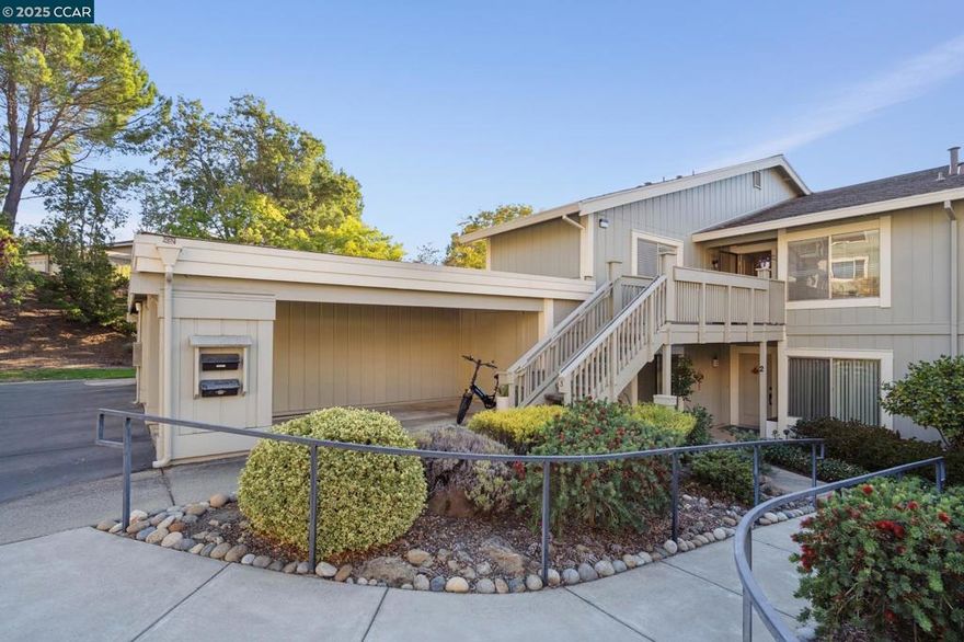 Enjoy sunsets & views of the serene surrounding hills in this wonderful Mariposa model. This Rossmoor gem is set above it all, tucked up the hill with/ a western outlook and offers a very private setting on the desirable Eastern side of the valley. If you love the quiet, you have it here! Bright, eat-in kitchen has updated cabinets with pull-out drawers, designer lighting, & Stainless-Steel appliances. The spacious Living/Dining room has a vaulted ceiling with large windows that are covered with elegant plantation shutters. Primary retreat has a skylight, vaulted ceiling and access to a private balcony. Crown molding + high baseboards throughout. Updated elegant Hall Bath, interior doors & carpet. The carport is located next to the entry with a roomy storage closet. The previous owner parked their car and golf cart in the space. Convenient EV charger. Plenty of guest parking nearby. This condominium is a must-see to fully appreciate! Enjoy the Bay Area's première Active 55+ community featuring golf, gym, pickle ball, lawn bowling, clubs, classes, lectures and a plethora of other activities.