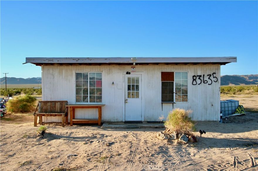 Discover your own high-desert hideaway in the heart of Wonder Valley! This rustic cabin on 5.7 acres offers endless potential for those looking to create a weekend retreat, artist escape, or investment property near Joshua Tree National Park and Twentynine Palms.

The existing structure is a classic Wonder Valley homestead cabin — weathered but full of character, ready for restoration or a complete re-imagining. The expansive acreage provides plenty of room for building, camping, or simply enjoying wide-open desert views, incredible stargazing, and peaceful seclusion.

Conveniently located along Highway 62, with power nearby and easy access to town amenities, yet far enough to capture the quiet and solitude that make Wonder Valley so special.

Bring your vision and tools — this one needs work but has all the ingredients for your next desert dream project.