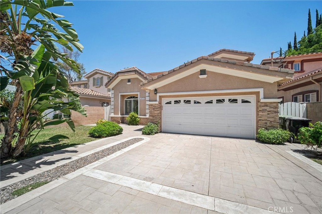 Welcome to this well-maintained two-story home featuring a bright, open layout ideal for both everyday living and entertaining. The main level offers high ceilings, recessed lighting, and tile flooring throughout the common areas. The spacious kitchen includes a center island with bar seating, ample cabinetry, and built-in appliances, flowing seamlessly into the dining and living spaces.
This home offers multiple flexible living areas perfect for a home office, media room, or playroom. Each room is filled with natural light and designed for comfort and functionality. The primary suite features dual sinks, a soaking tub, separate shower, and a walk-in closet to meet all your storage needs.
Additional highlights include a laundry room with upper cabinets, a 2-car attached garage, and a private backyard with low-maintenance landscaping—ideal for relaxing, entertaining, or weekend barbecues. Located in a quiet Reseda neighborhood close to parks, shopping, dining, and major freeways, this home offers both convenience and a welcoming community feel.