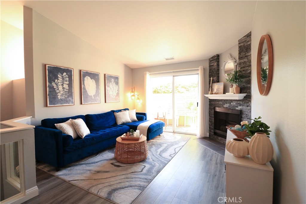 Back on the Market—Highly Desirable Home Available Once More! A rare second opportunity you won't want to miss!
Updated, Turnkey 2-Story Townhome with Dual Main Suites & Private Outdoor Spaces!
Welcome to this beautifully maintained 2-story townhome in a desirable gated community! Featuring two spacious main bedrooms, each with its own full bathroom, this layout offers flexibility for multi-generational living, roommates, or a dedicated home office. The downstairs suite has direct access to a private patio and is currently used as an office, while the upstairs suite opens to a balcony that can accommodate a small table and chair.
Enjoy the bright and airy open-concept living room with cathedral ceilings, a gas starter fireplace, and access to a second balcony with a privacy fence, built-in bench, and table—a relaxing space for morning coffee or evening downtime. The dining area connects seamlessly to the kitchen, which is equipped with a refrigerator, stove, and microwave. A convenient half bathroom completes the main living area.
Additional features include stylish and durable laminate flooring throughout, an attached two-car garage with washer and dryer hookups, quartz countertops throughout kitchen and bathrooms, a tankless water heater, and community access to a landscaped picnic area with a circular pergola and built-in seating.
Just minutes from shopping centers, restaurants, parks, a movie theater, and with easy access to the 710, 105, 91, and 605 freeways, this home offers the perfect blend of comfort and convenience.
Take advantage of this opportunity—schedule a private showing today!