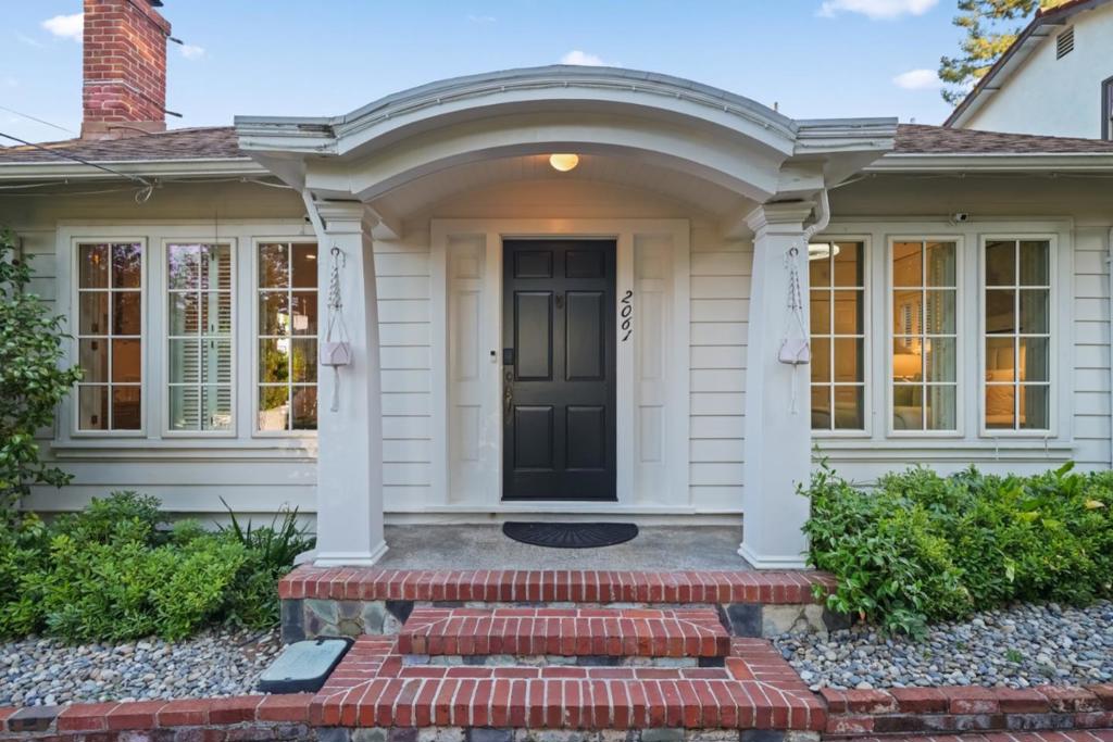 Tucked away in the storybook enclave of University Heights, this updated cottage-style home blends timeless charm with modern comfort. A formal entry leads to a spacious living room with fireplace and dining area with built-in cabinetry. The eat-in chef's kitchen features quartz countertops, stainless steel appliances and wood cabinetry seamlessly connecting to the backyard. The primary suite with updated en-suite bathroom features sliding doors to a private garden retreat. Two more bedrooms, hall bathroom and laundry complete the home. A detached, insulated garage offers ADU potential (buyer to verify), plus additional detached office provides flexible work space. New interior paint, electrical and plumbing upgrades, HVAC including air conditioning, EV charger, solar, smart lighting and more. Walking distance to Alameda shops, restaurants and top-rated Las Lomitas School district.