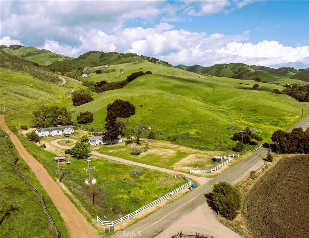 Stunning Panoramic Views On An Extraordinary 40.48 Acre Estate In A Sought-After Neighborhood In East Arroyo Grande On The Central Coast. The Main Residence Is A Spacious Haven With 4 Bedrooms and 3 Bathrooms. The Kitchen Offers Ample Space And Walk-In Pantry. A Expansive Living Room Boasts Vaulted Ceilings And Cozy Fireplace. Enjoy Views From The Family and Dining Rooms. A Charming 1 Bedroom, 1 Bath Guest House Along With Abundance of Storage With Rental Income. Estate Presents a Rare Opportunity to Build Your Dream Home Perched Away From It All, Revealing Captivating Ocean and Mountain Views Along With Sweeping Sunsets. Equestrian Paradise With Pastures And Ample Space for Horses and Livestock to Graze And Thrive. Onsite EV Charger, Garden, Fruit Trees, And A Chicken Coop Ready For Your Hens and Fresh Eggs! Only A Few Minutes To Branch Elementary And Just 7 Miles To The Village Of Arroyo Grande. Impressive 25 GPM Well. A Tranquil Escape and Valuable Opportunity To Own This Spectacular Property With An Abundance of Natures Beauty!