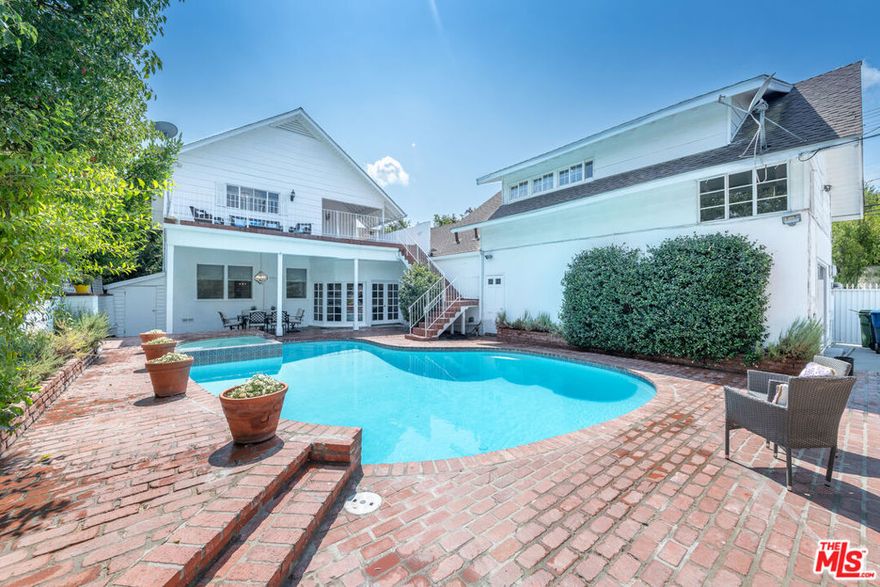 LARGE EAST COAST TRADITIONAL HOME with ATTACHED ADU!! AVAILABLE NOW. On a lovely street in PRIME Studio City, recently updated 7 Bd/5 Ba centrally located.  Hedged and Gated allows complete privacy. Fabulous floor plan with bedrooms both upstairs and downstairs. The gated entrance leads to beautiful gardens that surround the home. Spacious formal living room with a fireplace. The adjacent cook's kitchen connects to a formal dining area and step-down den.  The 1st floor has 3 bedrooms total; Two spacious bedrooms and a shared bath, plus, an additional private bedroom with its own bath. Upstairs are two master suites with ample closets and 2-room bath with an oversized separate vanity area.  Attached are multi-level guest quarters with 2 more beds and baths. Boasts its own kitchenette & private entrances. Easy indoor/outdoor access. A pool and hot tub in the backyard plus ample space that is great for entertaining, dinner parties, or just relaxing.  Near shops, restaurants, house of worship, Ventura Blvd., malls, Universal City Walk/Universal Studios, Warner Bros Studios, recording studios, etc.  Production Company & CO-LIVING friendly!  Ample parking on site, plus tons of street parking! PROPERTY IS COMPLIANT WITH EMERGENCY ORDER GUIDELINES.