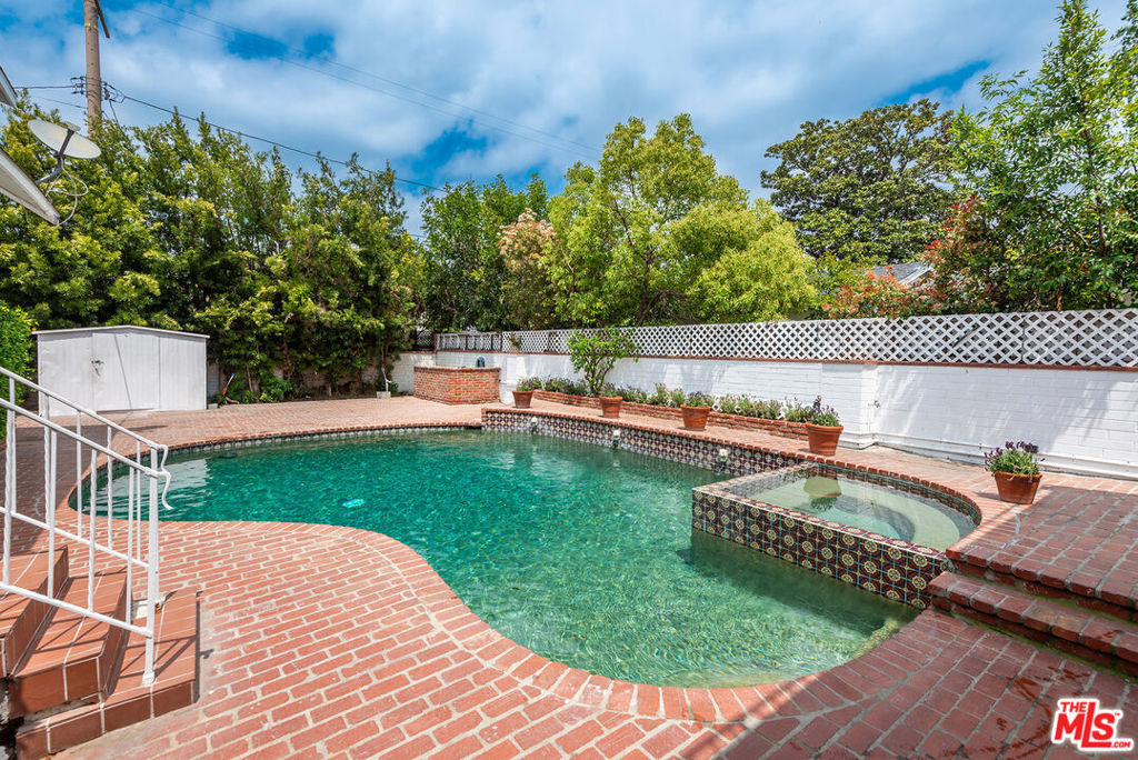 LARGE EAST COAST TRADITIONAL HOME with ATTACHED ADU!! AVAILABLE SEPTEMBER 5, 2025. On a lovely street in PRIME Studio City, recently updated 7 Bd/5 Ba centrally located. Hedged and Gated allows complete privacy. Fabulous floor plan with bedrooms both upstairs and downstairs. The gated entrance leads to beautiful gardens that surround the home. Enter the spacious formal living room with a fireplace. The adjacent cook's kitchen connects to a formal dining area and step-down den. The 1st floor has 3 bedrooms total; Two spacious bedrooms and a shared bath, plus, an additional private bedroom with its own bath. Upstairs are two master suites with ample closets and 2-room bath with an oversized separate vanity area. Attached are multi-level guest quarters with 2 more beds and baths. Boasts its own kitchenette & private entrances. Easy indoor/outdoor access. A pool and hot tub in the backyard plus ample space that is great for entertaining, dinner parties, or just relaxing. Near shops, restaurants, house of worship, Ventura Blvd., malls, Universal City Walk/Universal Studios, Warner Bros Studios, recording studios, etc. Production Company & Roommate friendly! Live in the South wing of the house and run your business from or rent out of the North Wing. Spaces can be converted for other purposes: office, fitness studio, music studio, screening room, etc!! Ample parking on site, plus tons of street parking! PROPERTY IS COMPLIANT WITH EMERGENCY ORDER GUIDELINES.