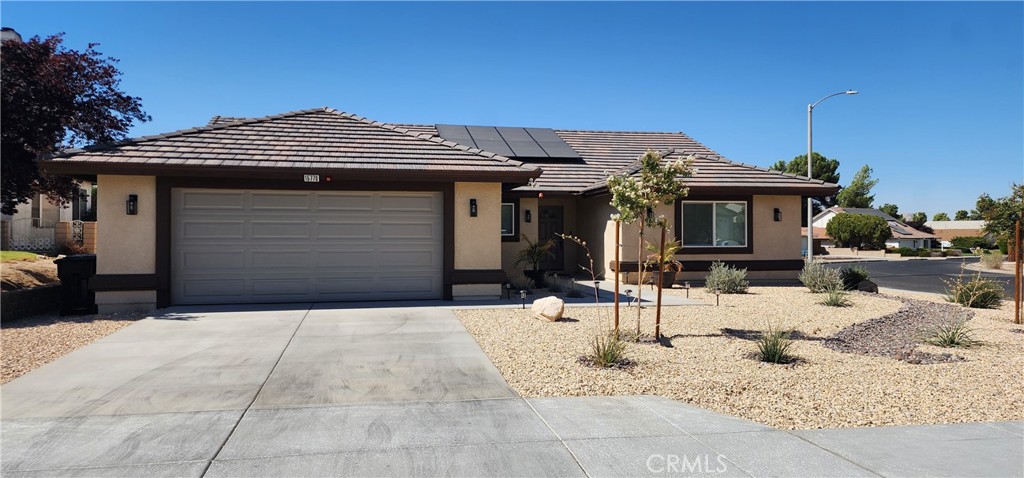 Welcome 15770 Nassau Dr, a beautiful single-story custom home in the highly sought-after Green Tree Golf course community of Victorville. Offering 3 bedrooms and 2 bathrooms across 1,723 square feet, this home combines comfort, and style. Step inside to soaring vaulted ceilings and an open, airy layout filled with natural light. The interior features laminate flooring throughout, complemented by sleek tile in the bathrooms, while the open kitchen boasts white shaker cabinetry, granite countertops, stainless steel appliances—perfect for both everyday living and entertaining. All three bedrooms are generously sized, and they all include a walking closet. Additional features include smart door handles, smart entry, smart appliances, smart lighting throughout, Alexa integrated smart speaker system in the master bathroom, Bluetooth speaker system in the hallway bathroom, tankless water heater and so much more. Outside, you can enjoy family gatherings under the custom covered porch which includes an exterior shower with hot/cold water, TV connections, and gas connections ready for your grilling station. The front yard is beautifully landscaped with drought tolerant plants, and the 2-car attached garage offers plenty of space for vehicles and storage. The garage motor comes with camera system for added security. Nestled on a 10,374-square-foot lot in a quiet, family-friendly neighborhood, this home offers the perfect blend of charm, modern upgrades, and a peaceful setting. If this wasn't enough then let me tell you Costco, Home Depot and other major retailers are within 10 minutes distance from the home. Easy freeway access!