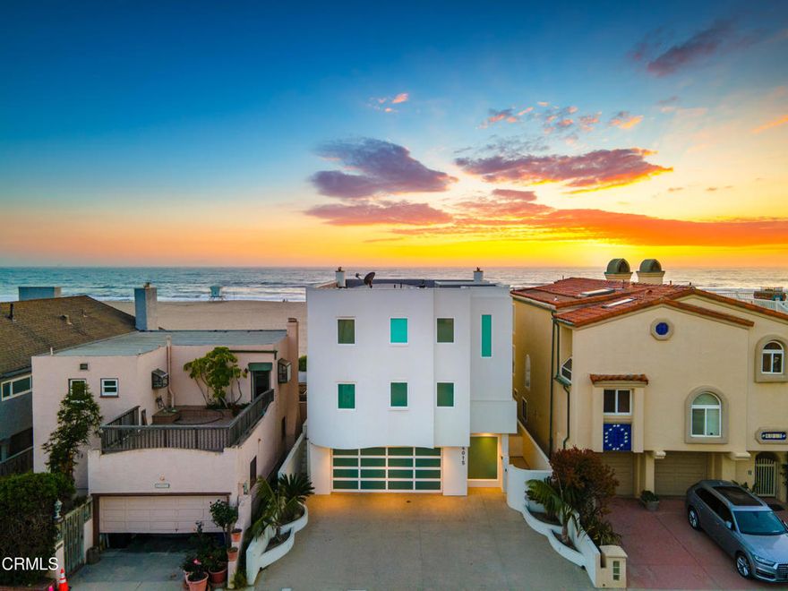 Nestled along the shores of Hollywood Beach. This custom-built modern oceanfront home, crafted with meticulous attention to detail.  A floating glass staircase, a work of art in its own right, guides you through each level. The heart of the home, the kitchen, is a haven for culinary enthusiasts. Snaidero cabinetry from Italy, Meile appliances, and stone countertops beckon the chef within to create culinary delights against a backdrop of ocean views and salty breezes.  From almost every corner, the azure waters of the ocean and the tranquil silhouette of nearby islands paint a mesmerizing picture. Whether you're in the master bedroom, feeling as if you're on a perpetual tropical vacation, or lounging in the living area, every moment is accompanied by the soothing melody of waves crashing against the shore.  Hollywood Beach, a hidden gem nestled between Malibu and Carpinteria, offers more than just scenic beauty. Its quaint streets are adorned with charming restaurants, lively pubs, and a bustling farmers market, inviting you to explore the coastal treasures that lie just beyond your doorstep.  This coastal oasis, built with passion and vision in 2006, redefines luxury living with its panoramic ocean views and seamless indoor-outdoor connection. Floor-to-ceiling windows capture the ever-changing canvas of the sea, while custom architectural features, like the floating steel staircase, elevate the aesthetic allure.  The home's interior bathes in natural light, courtesy of custom Kalwall panels and strategically placed skylights. Heated Seagrass Limestone flooring adds a touch of warmth, while a Bang & Olufsen sound system fills the air with melodious tunes, creating an ambiance of pure bliss.  Entertainment awaits on every level, from the oversized bedroom on the sand level, perfect for guests  quarters, to the main level's oceanfront area with its cozy fireplace and surround sound system. . Upstairs, two guest bedrooms offer luxurious retreats, each with an en-suite bathroom featuring Japanese soaking tubs and heated floors. The primary suite has unobstructed ocean views, a cozy fireplace, and a spa-like bathroom complete with a lighted and jetted soaking tub.  In this coastal haven, every detail is thoughtfully curated, every space a testament to the beauty of oceanfront living. Welcome to a life of luxury, where the sea meets the sky, and every day feels like a dream on Hollywood Beach.