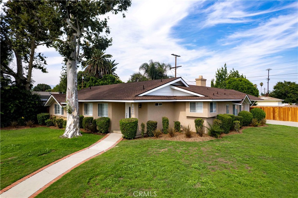 SIMPLIFIED & FAMILY-FOCUSED - Welcome to 10500 Dempsey Avenue — a spacious, light-filled home on a beautifully landscaped corner lot in Granada Hills. This 3-bedroom, 3-bathroom retreat offers nearly 2,000 square feet of thoughtfully designed living space, perfect for families seeking comfort, charm, and convenience. From the moment you arrive, the curb appeal and wraparound yard invite you to imagine weekend barbecues, cozy evenings by the fireplace, and everyday ease in a home that truly fits your lifestyle.
Inside, enjoy designer hardwood floors, a cozy fireplace, and a modern kitchen with designer cabinets. Central air and heat, an inside laundry room, and plenty of storage make daily living effortless. The two-car garage with openers adds convenience, while the large yard with sprinklers makes outdoor living a breeze.
Located just a short walk from award-winning Granada Hills Charter High School and close to shopping and major freeways, this home is ready to welcome your next chapter.