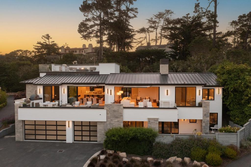 Located in the prestigious Residences at Pebble Beach, just steps from The Lodge and Beach & Tennis Club, this beautifully remodeled oceanview home offers nearly 5,000 sqft of luxury living. The main level features a great room with an open kitchen, dining area & full bar that flows to a large deck w/outdoor kitchen, pizza oven, fire pit & seating areas. The primary suite includes a fireplace, dual bathrooms & his/her walk-in closets. Addl highlights include 3 ensuite guest bedrooms, 2 powder rooms, 2 laundry rooms, an office, theater, oversized 3-car garage, top-tier sound, lighting & security systems, plus a rooftop deck w/outdoor kitchen, fire pit, dumbwaiter & stunning views of PB golf course, Stillwater Cove, Carmel Beach & Point Lobos. Like living at The Lodge, enjoy coffee at The Gallery, lunch at the Market, or sunset cocktails at The Bench, Tap Room or Stillwater Grill. With landscaping maintained by Pebble Beach Company, this home offers effortless indoor-outdoor living in a prime Pebble Beach location.