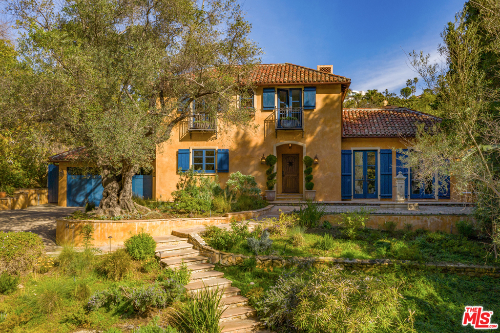 Enchanting 1937 Bird Streets Mediterranean w/permitted guest house. Impeccably renovated, updated, and maintained. Move-in condition! Privacy abounds as home is set back from street w/mature landscaping. 1st floor: stair hall; sunken LR w/FP; library; powder. Formal DR w/FP opens onto courtyard w/cooking area & outdoor FP. Light-filled chef's kitchen w/high-end appliances, breakfast area, walk-in bar & butler's pantry. Service area includes laundry, direct access 2-car garage, maid's en suite (or home office) overlooking kitchen patio. 2nd floor: master w/FP, luxurious bath, 2 dressing rooms, balcony w/stairs leading to grounds. Two additional en suites w/large closets & tiled baths. Back garden is an oasis w/huge salt water pool & expansive lawn. Guest house contains spacious studio w/FP. Abundant storage inside & out; finished CA basement. Property is fully-irrigated w/outdoor lighting. Optimum for entertaining or private moments & only minutes north of Sunset Blvd.