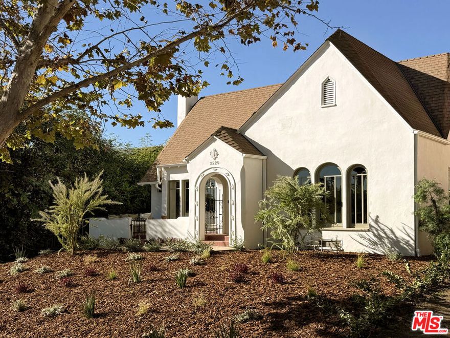 Exquisitely restored and renovated, this 1925 English Storybook home blends historic charm with modern luxury and fully updated systems all within an ideal floor plan. The 4bed/3bath residence showcases custom mill work, solid oak floors, elegant designer finishes, coved ceilings, and a beautiful sunlit chef's kitchen, plus a generous basement perfect for storage or a wine cellar. The property includes a newly built ADU with 1bed/1bath and an additional versatile loft space perfect for a studio. The large landscaped flat yard offers space for entertaining or a future swimming pool. Located north of the boulevard, just 3 blocks to Hillhurst Avenue's vibrant shops and cafes, easily accessible to Griffith Park's hiking trails and within the coveted Franklin Elementary school district.