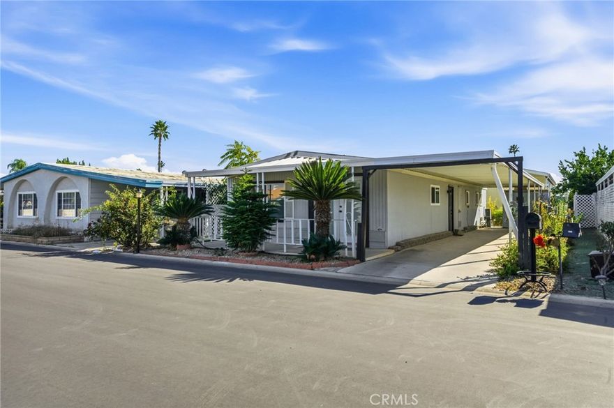 Stylishly Updated Home in the Desirable 55+ Colonial Country Club!
Step inside this beautifully refreshed 2 bedroom, 2 bathroom home offering over 1,000 sq. ft. of comfortable, modern living. A wide French front door with integrated mini-blinds welcomes you into the open living and dining area, creating an inviting flow perfect for relaxing or entertaining.

Thoughtful upgrades are found throughout, including brand-new waterproof vinyl plank flooring, upgraded light fixtures, four modern ceiling fans, and newly installed bathroom vanities that enhance the home’s clean and contemporary feel. Dual pane windows brighten the interior while improving energy efficiency. The kitchen opens into the main living area and includes a refrigerator, while the washer and dryer are also included for added convenience. A newer HVAC system and central A/C ensure year-round comfort. The property also features an irrigation system to help maintain exterior landscaping with ease.

Outside, a covered carport offers protected parking along with an additional storage shed—ideal for golf clubs, seasonal décor, or hobby equipment.

Located within the vibrant Colonial Country Club, this active 55+ community offers an incredible array of amenities: an executive 18-hole golf course, six new pickleball courts, year-round swimming pool and spa, indoor shuffleboard courts, billiards room, fitness center, ballroom, library, on-site hair salon, horseshoe pits, community laundromat, a dedicated dog park, and more. This pet-friendly community delivers true resort-style living, with shopping, dining, entertainment, and major conveniences all close by.

Discover comfort, style, and an exceptional lifestyle at Colonial Country Club!**Mobile Home Park Land Lease $999 per month**