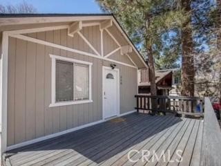 welcome home to picturesque neighborhood of Sugarloaf, 2 bedroom 1 bath cozy cabin , chalet style, furnished , featuring cozy rock wood burning fireplace, vaulted ceilings, ceiling fans, fenced back yard with storage shed.