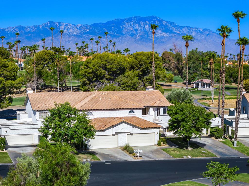 Welcome to 357 Desert Falls Drive East, an exceptional top-floor condo in the guard-gated Desert Falls Country Club, offering 3 bedrooms, 2.5 bathrooms, and 1,814 sq. ft. of light-filled living space. Perfectly positioned in the heart of Palm Desert, this home combines comfort, style, and investment potential--ideal as a full-time residence, seasonal getaway, or short-term rental. Inside, a bright and airy floor plan showcases soft neutral paint, plush carpeting, and custom shutters throughout. The spacious Great Room features a cozy fireplace and flows effortlessly into a dedicated dining area and a charming breakfast nook, creating an inviting space for everyday living and entertaining. The well-appointed kitchen boasts updated stainless steel appliances, a raised breakfast bar, and ample storage, making it both functional and stylish. The primary suite is a private retreat with a large corner soaking tub, perfect for unwinding after a day on the course. Two additional bedrooms provide flexibility for guests, a home office, or personal pursuits. Additional highlights include a detached two-car garage and furnishings included for ultimate convenience. Desert Falls Country Club is renowned for its amenities and prime location. Golfers will appreciate the 18-hole championship course, designed by internationally acclaimed architect Ron Fream, ranked among the top 10 courses in the Coachella Valley by the Southern California PGA and earning a four-star rating from Golf Digest's Best Places to Play. Beyond golf, residents enjoy a vibrant clubhouse featuring two restaurants, meeting rooms, and event facilities, along with tennis and sports courts and a lively social calendar. The community's 24-hour guard-gated security ensures peace of mind, and short-term rentals are permitted--adding significant value for investors. Set in Palm Desert's sought-after country club corridor, you're minutes from world-class shopping, dining, entertainment, and resorts, with easy access to golf, hiking, and the greater Coachella Valley. This Desert Falls residence blends location, lifestyle, and flexibility, offering a true desert retreat ready to enjoy.