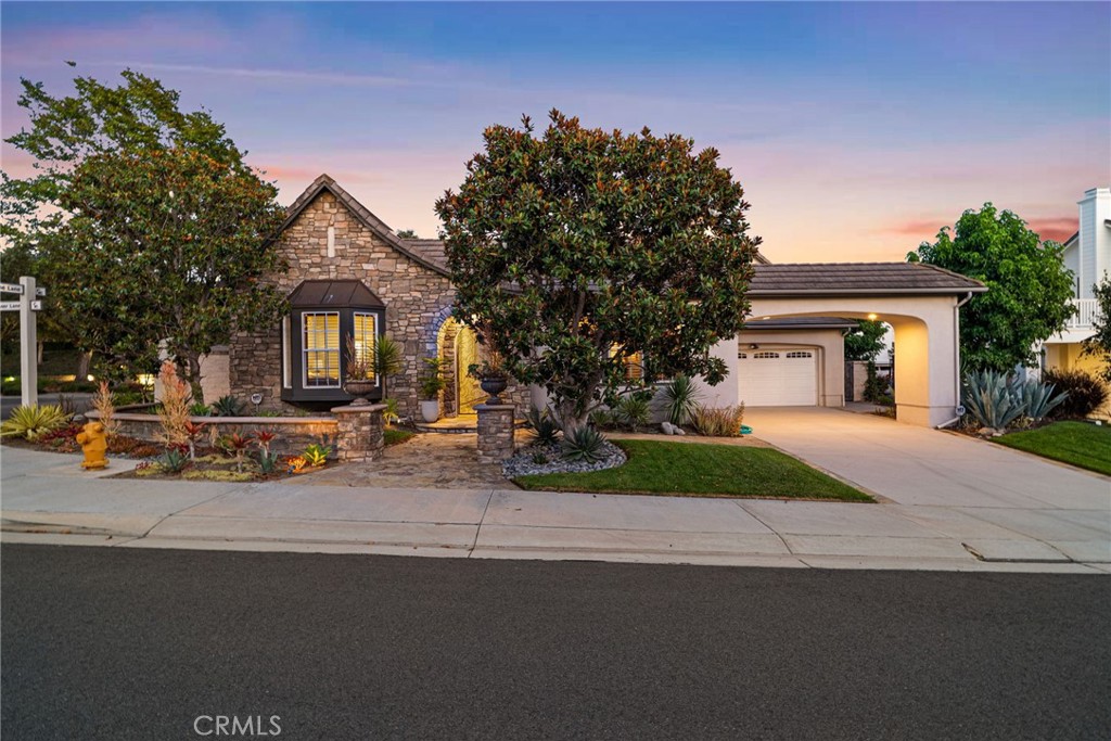 Welcome to an unparalleled living experience at 2 Michener Lane, an exquisite private residence nestled within the prestigious guard-gated community of Coto De Caza. Step inside this completely remodeled masterpiece, where luxury meets bespoke design and modern efficiency, highlighted by a fully paid solar system.
As you enter, you're greeted by 20-foot vaulted ceilings adorned with elegant 10-inch crown molding, setting the tone for the grandeur that unfolds. The antimicrobial porcelain tile floors promise both durability and elegance. The heart of the home, the kitchen, is a chef’s dream — a space where culinary creativity and style unite. It features a custom-designed large center island, premium finishes, ample storage, and entertaining areas, seamlessly flowing into the family room, ideal for gatherings with sweeping views of the private, lush backyard.
The main floor hosts a sumptuous primary bedroom, a private sanctuary with a spa-like bathroom boasting a lavish soaking tub and exquisite herringbone marble shower. An additional main-level bedroom offers comfort and privacy for guests, with both spaces benefitting from the home’s energy-efficient solar power.
Beyond the interiors, the outdoor living area is a haven for relaxation and enjoyment. The fully remodeled backyard is an entertainer's paradise, featuring an oversized built-in barbecue and bar, plus a refreshing spool and pergola, perfect for peaceful mornings or vibrant gatherings. The side yard, crafted for an herb garden, enhances the home's charm and functionality.
A front casita provides versatile space, suitable as a guest retreat or workout area, spacious enough for a Peloton or yoga practice. The 3-car garage is a storage dream, equipped with built-in cabinets on three walls.
Located in the heart of Coto De Caza, this residence offers resort-style amenities, including golf, biking, hiking trails, a community pool, spa, and workout facilities. Proximity to award-winning blue ribbon and private schools further elevates its allure.
This exceptional home is not just a residence; it’s an experience, waiting for those who seek both luxury and tranquility. Discover fine living at 2 Michener Lane—a must-see property that captivates and inspires.
