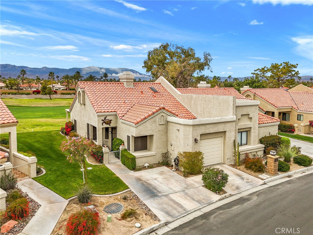 Welcome to 41497 Princeville Lane – a rare gem in Palm Desert Resort Country Club. This is one of the only locations and properties where you can have it ALL. Situated on one of the most desirable streets in the community—known as “The Resorter” and home to the valley's largest pickleball club—this west-facing property offers breathtaking mountain and golf course views, all while being set back just enough to enjoy privacy and tranquility. With green space right outside your extended back patio and the nearest pool just a short stroll away, it’s the perfect blend of scenery and convenience.
This home features the highly sought-after Augusta floor plan, thoughtfully updated to improve flow and function. The kitchen and dining area have been expanded to enhance entertaining space and capture even more of the incredible mountain views. Inside, you'll find newer appliances, upgraded A/C, and beautifully remodeled, spa-inspired bathrooms—including a luxurious primary bath with dual sinks and a walk-in shower. Offered turnkey furnished, this home is truly move-in ready. The extended patio, complete with a stylish pergola, is ideal for morning coffee or relaxing evenings with friends.
Located just a short distance from the back gate for quick access to El Paseo, the home is also within walking distance to the clubhouse, pickleball courts, golf starter, and all of the fantastic amenities the Palm Desert Resort Country Club has to offer. Community amenities include a championship 18-hole golf course, 28 pickleball courts, 7 tennis courts, a clubhouse with café and pro shop, bocce ball courts, a dog park, and 20 pools and spas throughout the resort. Perfectly positioned in the heart of Palm Desert, you're only minutes away from El Paseo, Acrisure Arena, world-class shopping, dining, and easy freeway access. With short-term rentals allowed, this home makes an excellent full-time residence, vacation getaway, or investment property.
41497 Princeville Lane is more than just a home — it's a lifestyle. Don’t miss this rare opportunity to own a slice of desert paradise in one of the Coachella Valley’s most vibrant communities.